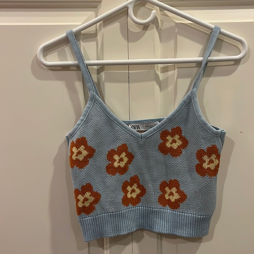 Knit blue tank top with orange flowers